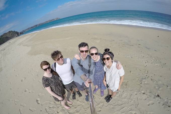 A group selfie on the beach