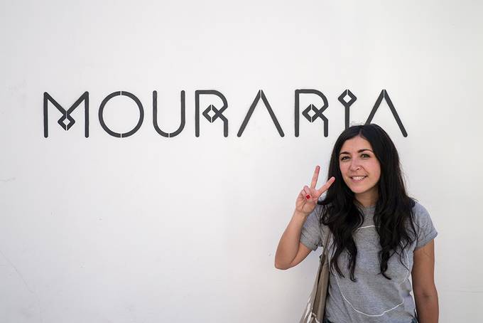 Me in front of a Mouraria sign